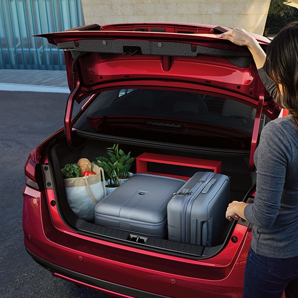 2024 Nissan Versa rear view of open trunk with luggage and groceries inside